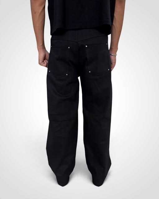 Black wide-leg denim worn with a black top