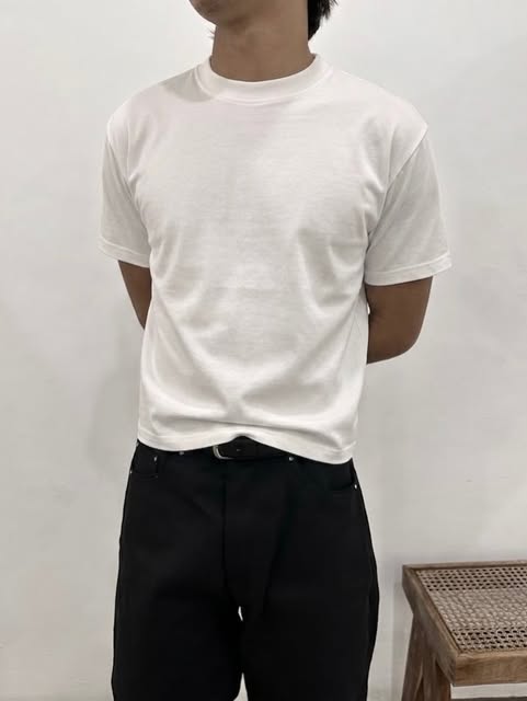 White T-shirt worn with dark trousers