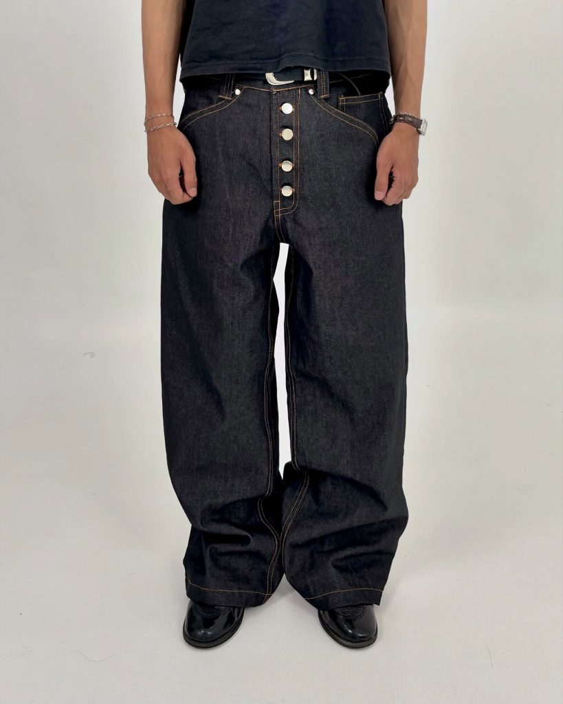 Milano raw denim with five exposed buttons and gold stitching