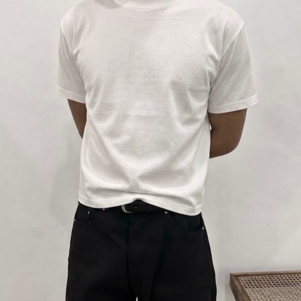 Classic Core Neutral White boxy T-shirt worn with dark trousers